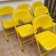 Ensemble de six chaises en métal pliantes jaunes Eurosit