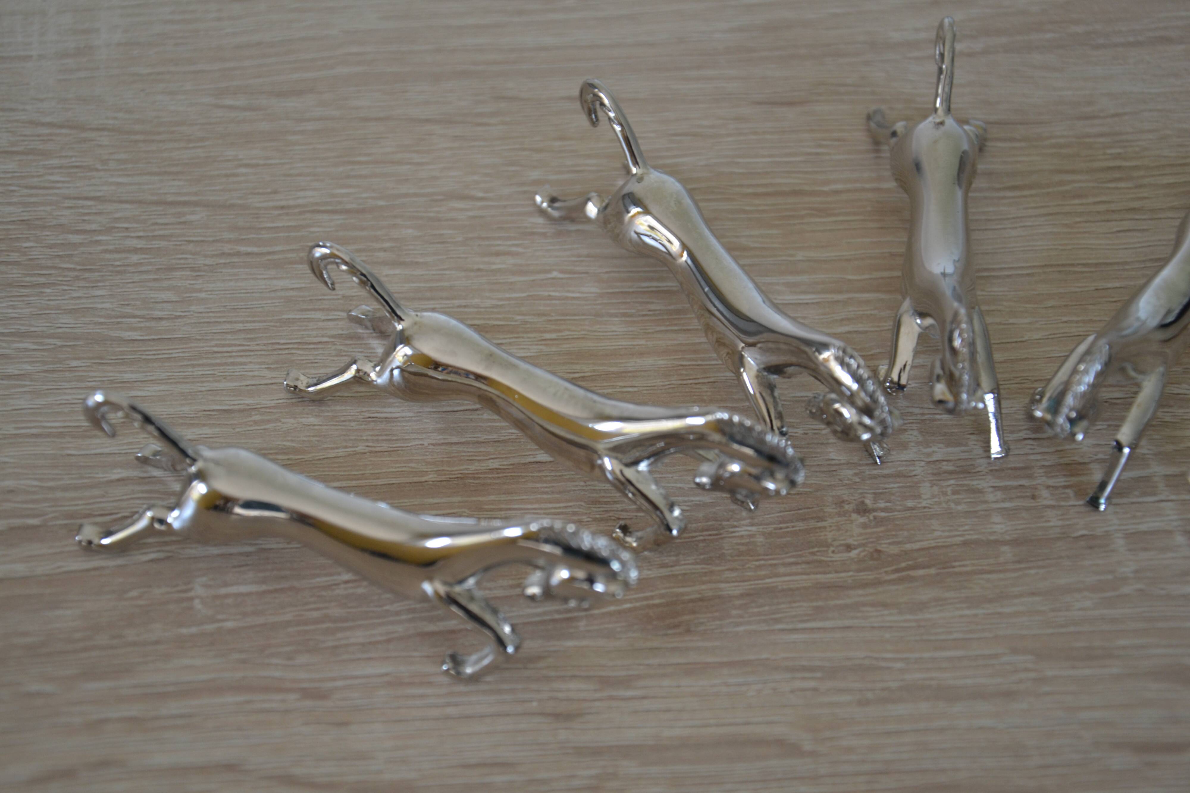 6 silver-plated "horse" knife rests