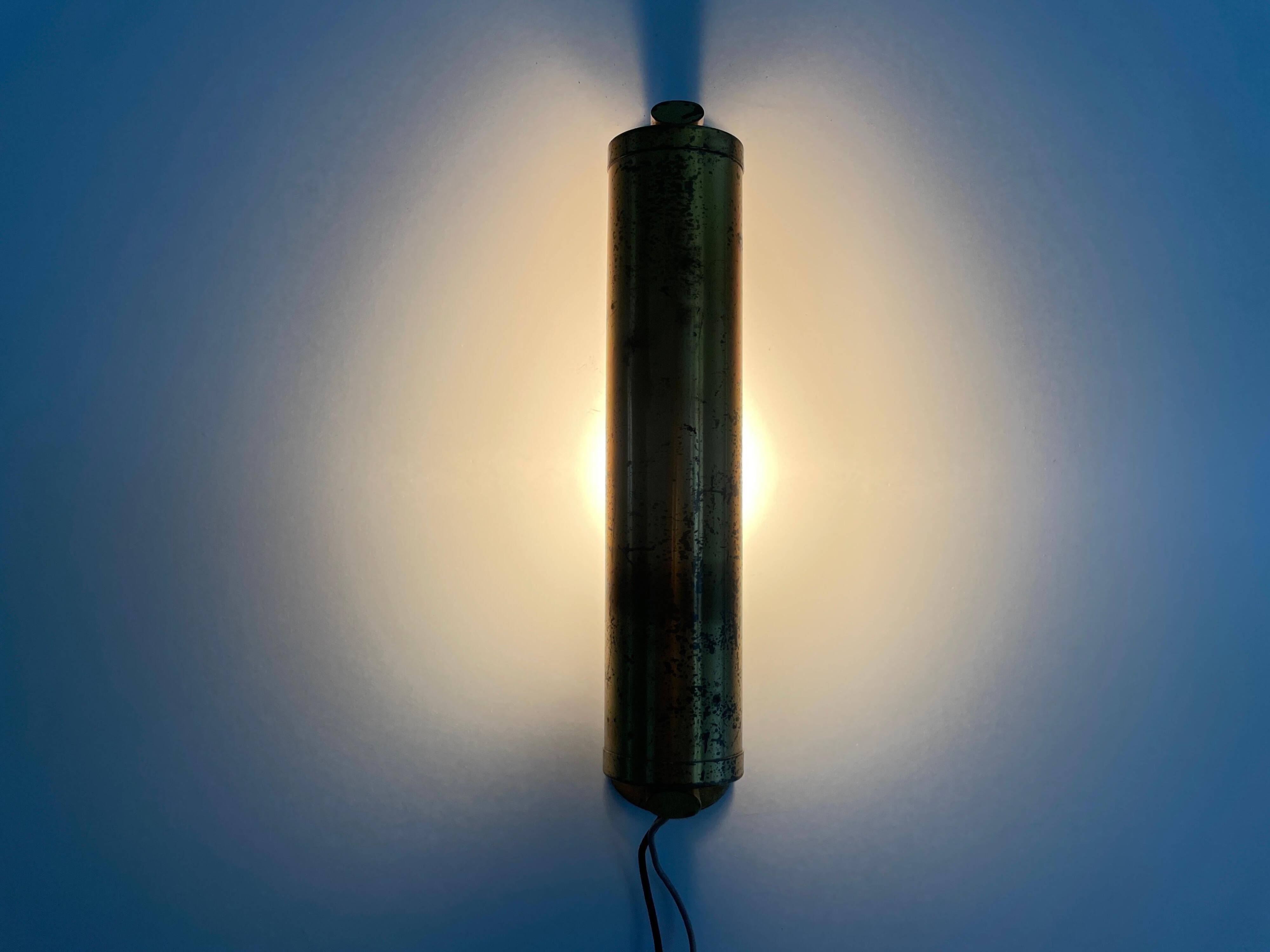 Small simple cylindrical brass wall light from the mid-century, 1950s, Germany.