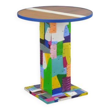 Handmade table made from recycled materials, colourful, abstract.