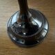 Varnished black metal candlestick