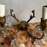 Pair of Louis XV style wall sconces in gilded bronze with glass pendants.