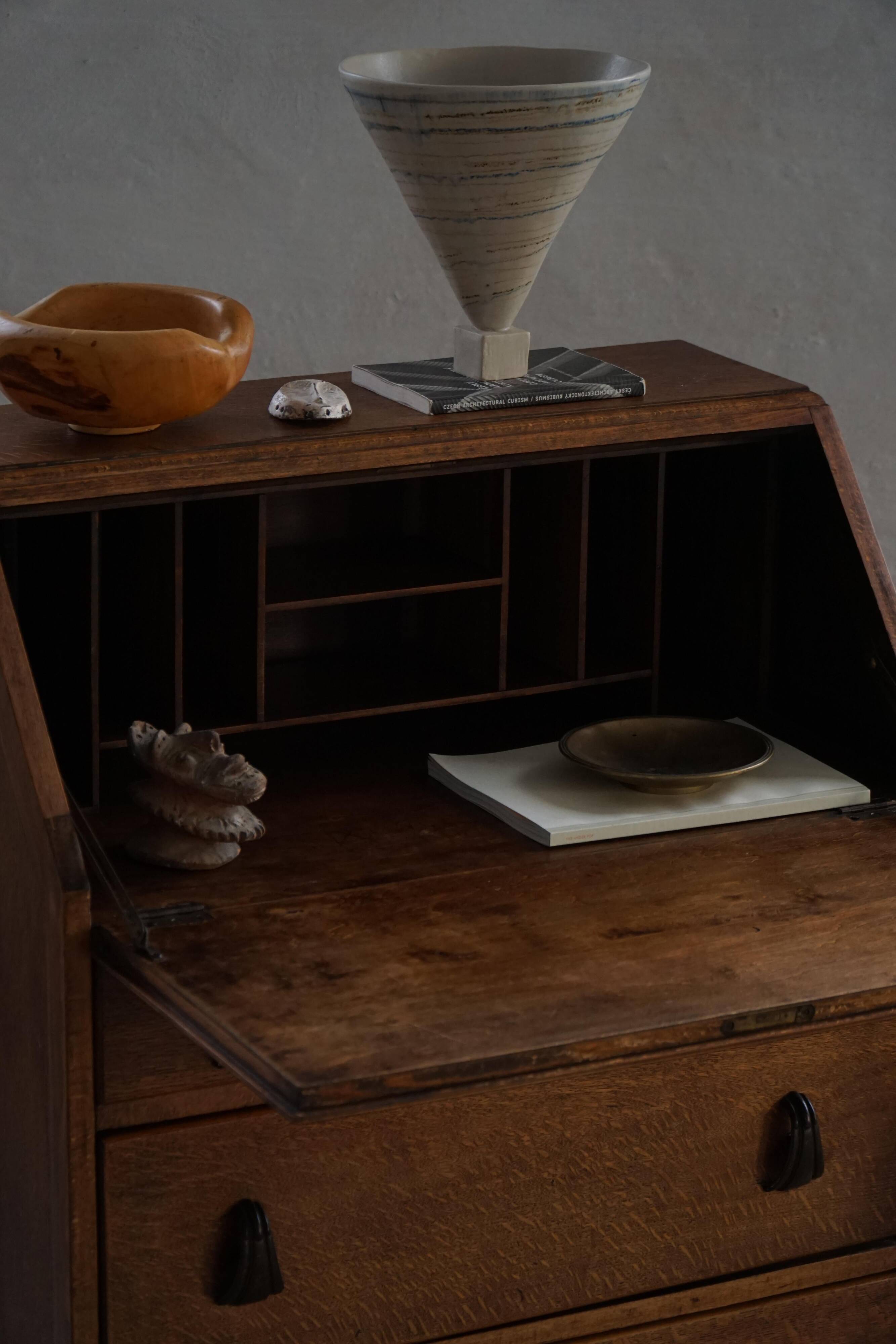 Desk / Chest of drawers in modern Danish oak from the early 20th century with shell handles.