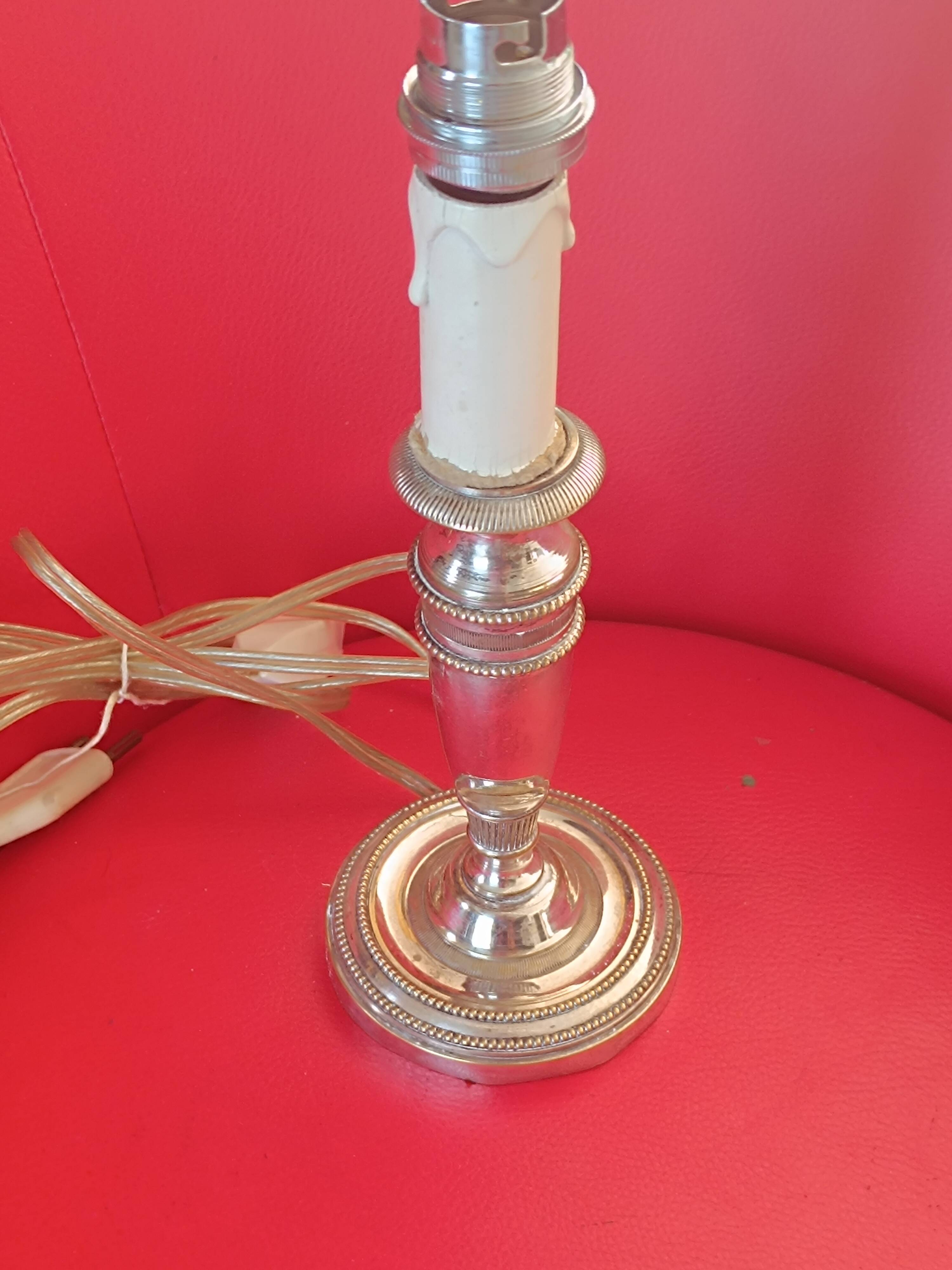 Old lamp base in silver metal.