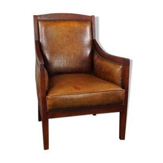 Armchair in sheepskin with wood