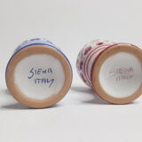 Pair of hand-decorated blue and garnet cockroaches signed "Siena Italy"