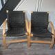 pair set of 2 armchairs with a wooden frame and black fabric weaving