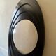 Large oval Italian mirror, modernist, space age design from the 1970s.