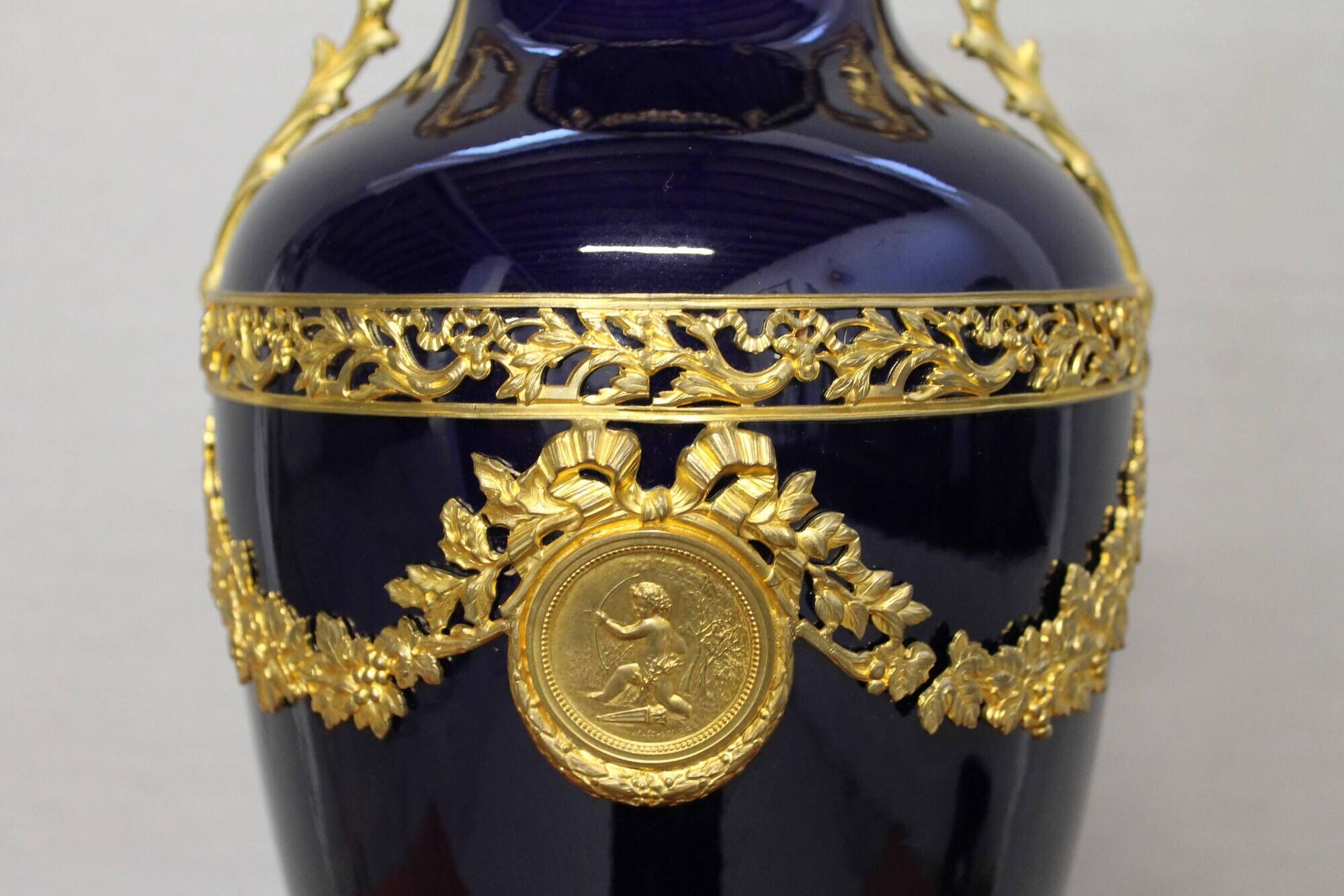 Vase signed Legastelois in blue ceramic of Sèvres and gilded bronze