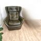 Dark green vintage leather armchair: 1970s Scandinavian style