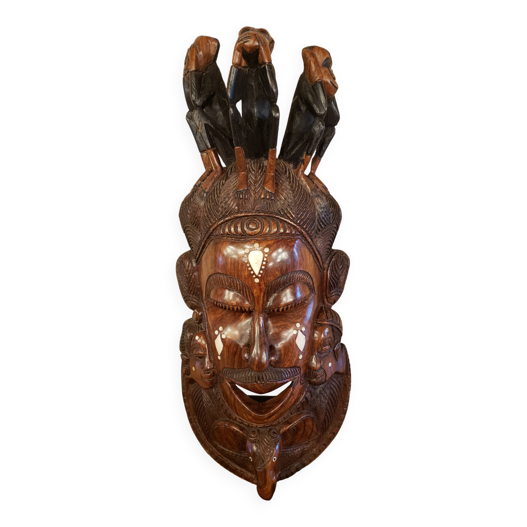 Old large African wall mask in carved wood