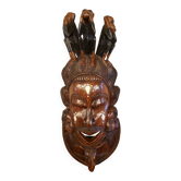 Old large African wall mask in carved wood