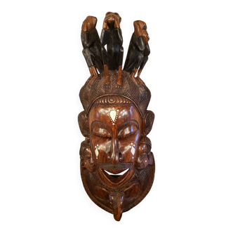 Old large African wall mask in carved wood
