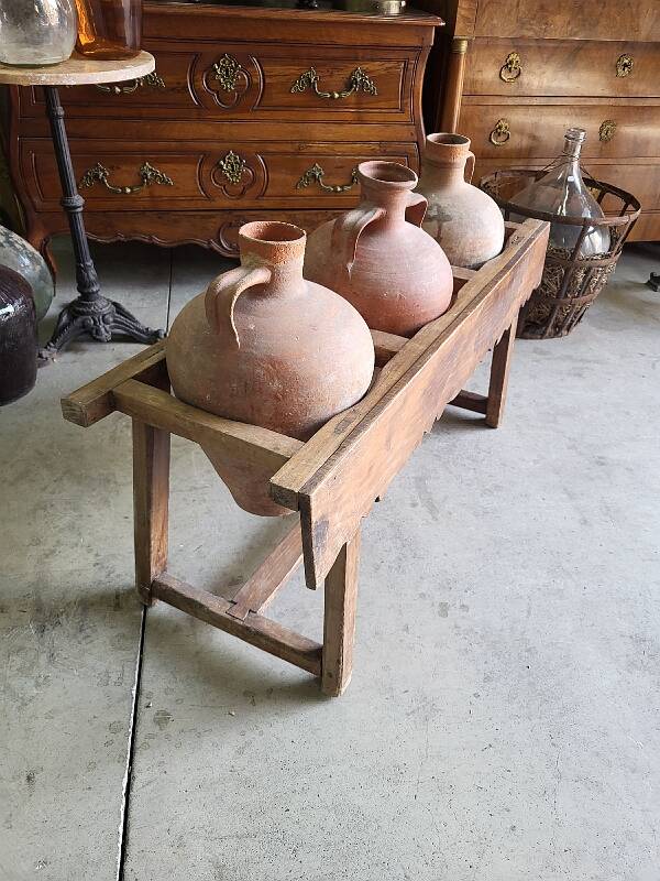 Old wooden jar holder with 3 clay jars