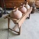 Old wooden jar holder with 3 clay jars