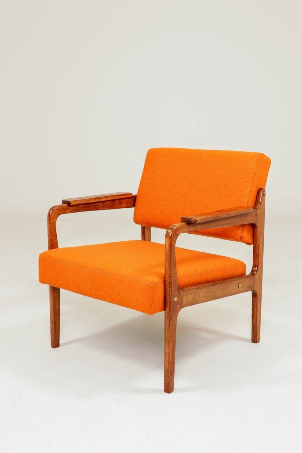Vintage armchair in papaya orange wool from the 1960s.