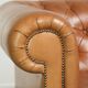 Sheepskin 2.5-seater Chesterfield sofa in a light cognac colour