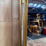 Napoleon III mirror in wood and gilded stucco with gold leaf.