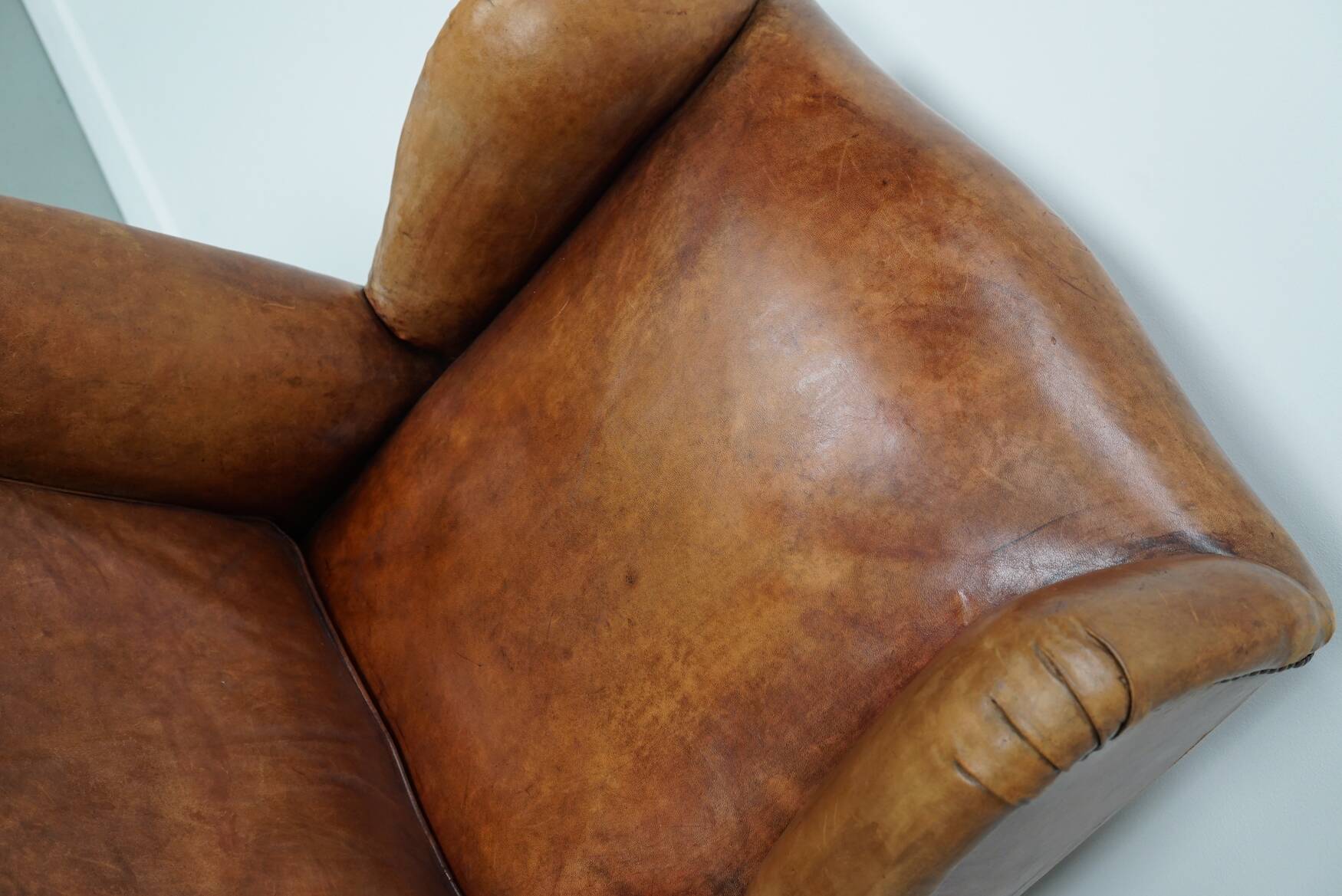 Vintage Dutch cognac coloured leather club chair, with footstool