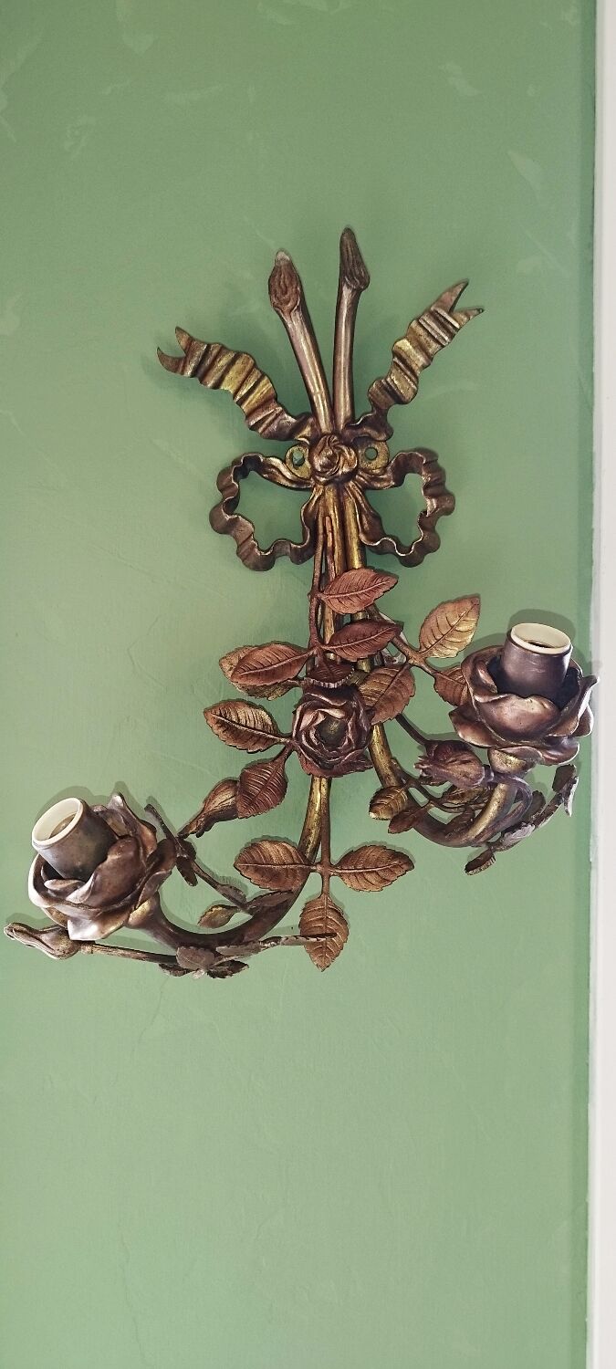 Pair of bronze and gilded metal wall sconces in the Louis XVI style.