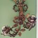Pair of bronze and gilded metal wall sconces in the Louis XVI style.