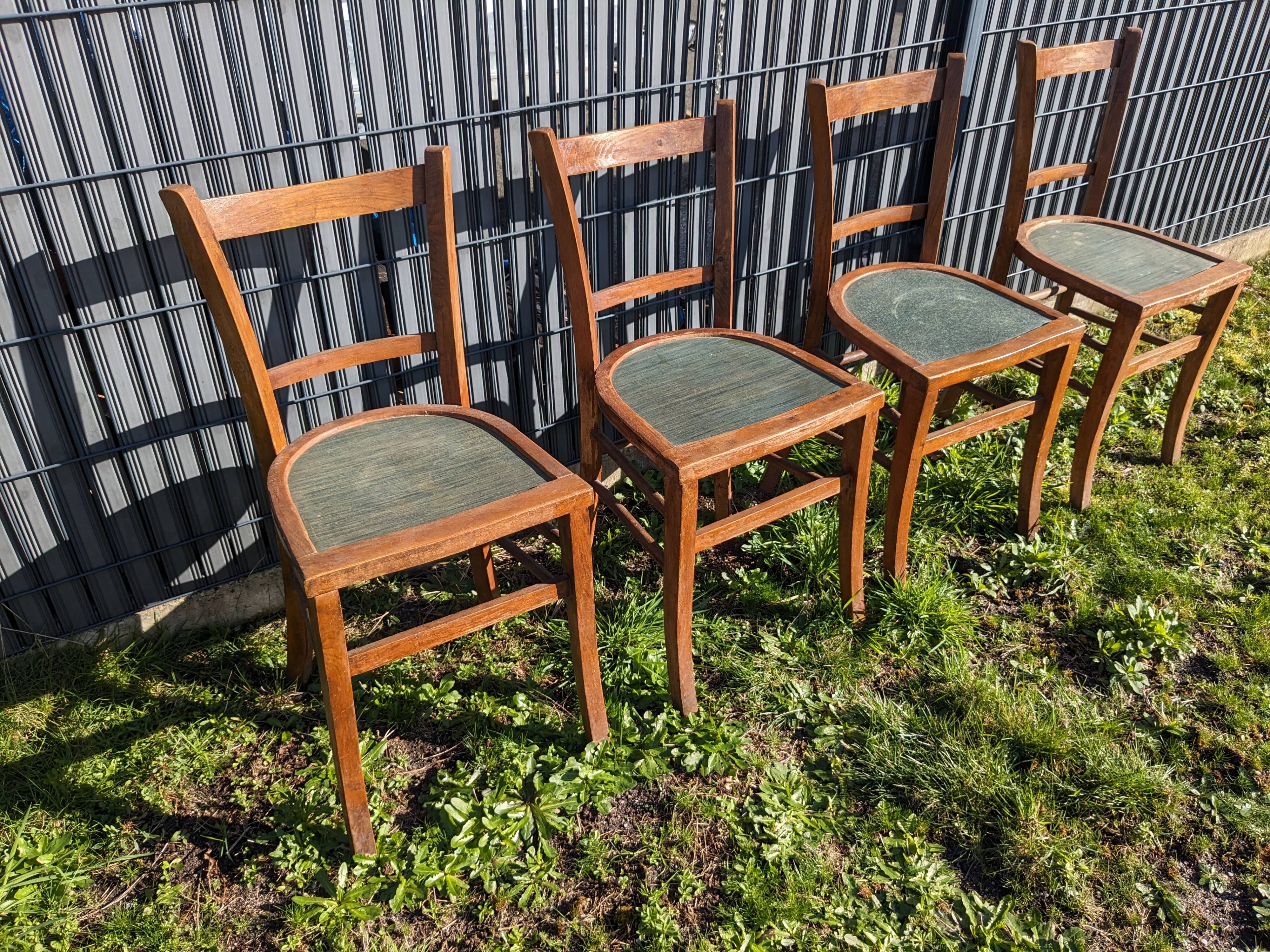 Set of four wooden bistro chairs, green seat, mid-20th century.