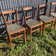 Set of four wooden bistro chairs, green seat, mid-20th century.