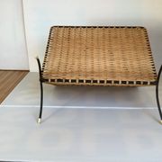 Old magazine rack in straw and black metal
