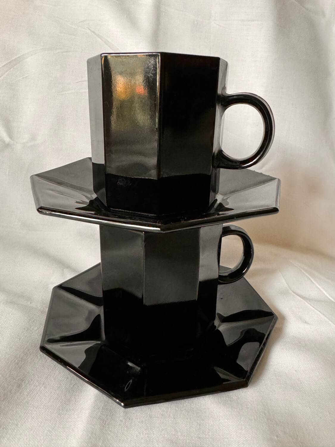 Set of 2 arcoroc black glass coffee cups with underplates