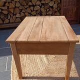 Low farmhouse table in raw wood