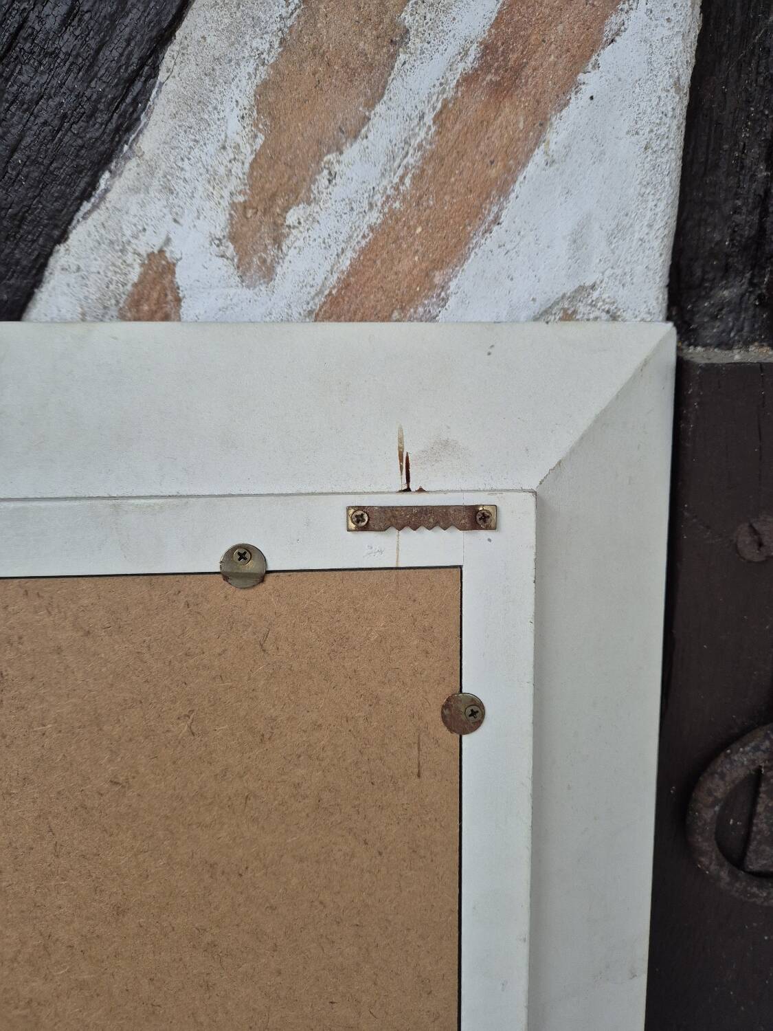 Oval mirror with a distressed white frame