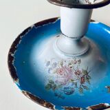 Old enamelled metal candlestick