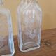 Pair of old engraved and frosted glass bottle vases.