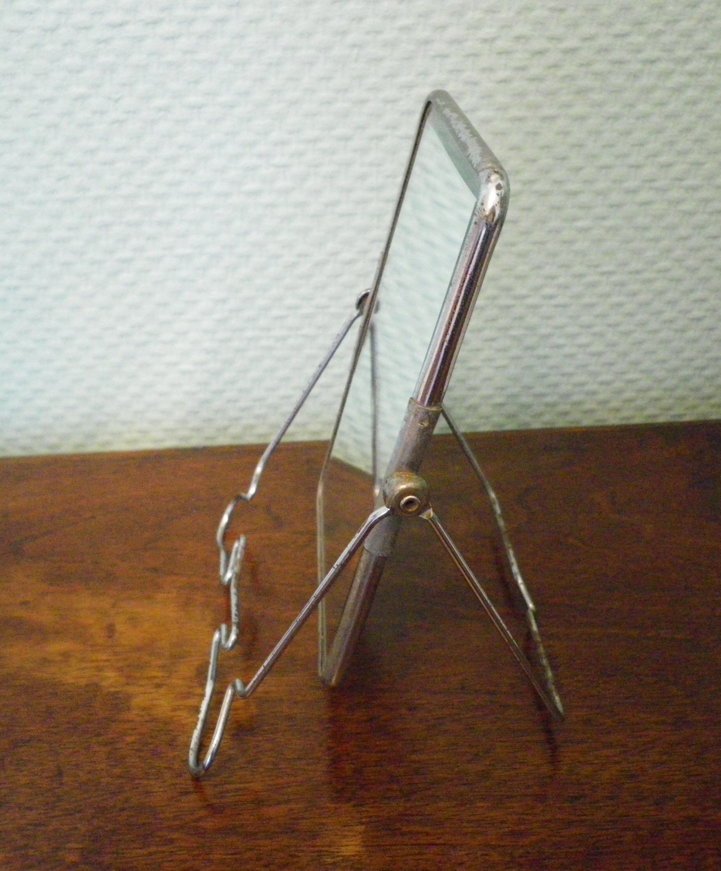 Two-foot barber mirror, suspension mode, beveled, chrome metal - 70s -
