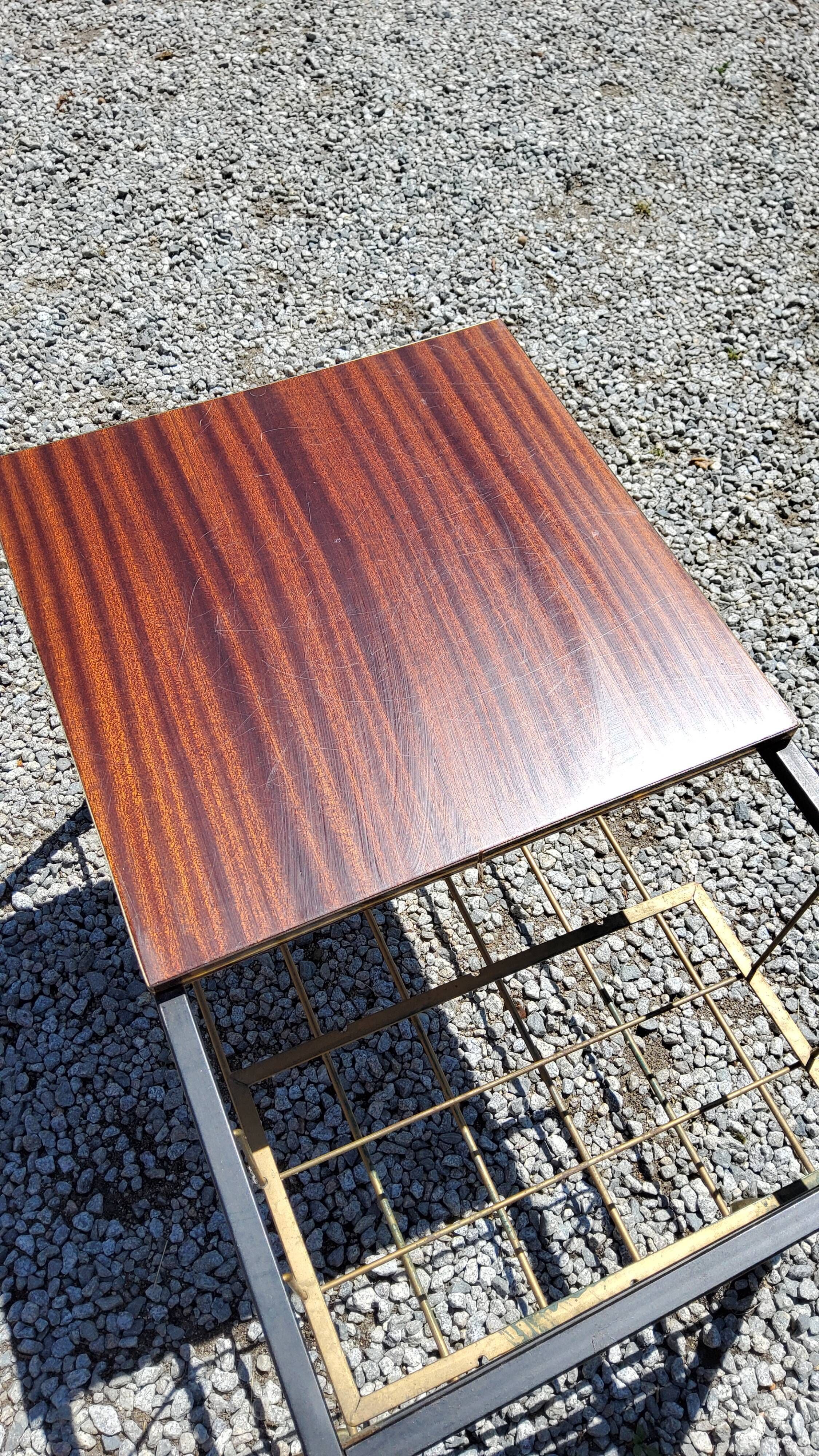 Coffee table from the 60s in black and gold metal tubes mahogany formica top