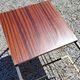 Coffee table from the 60s in black and gold metal tubes mahogany formica top
