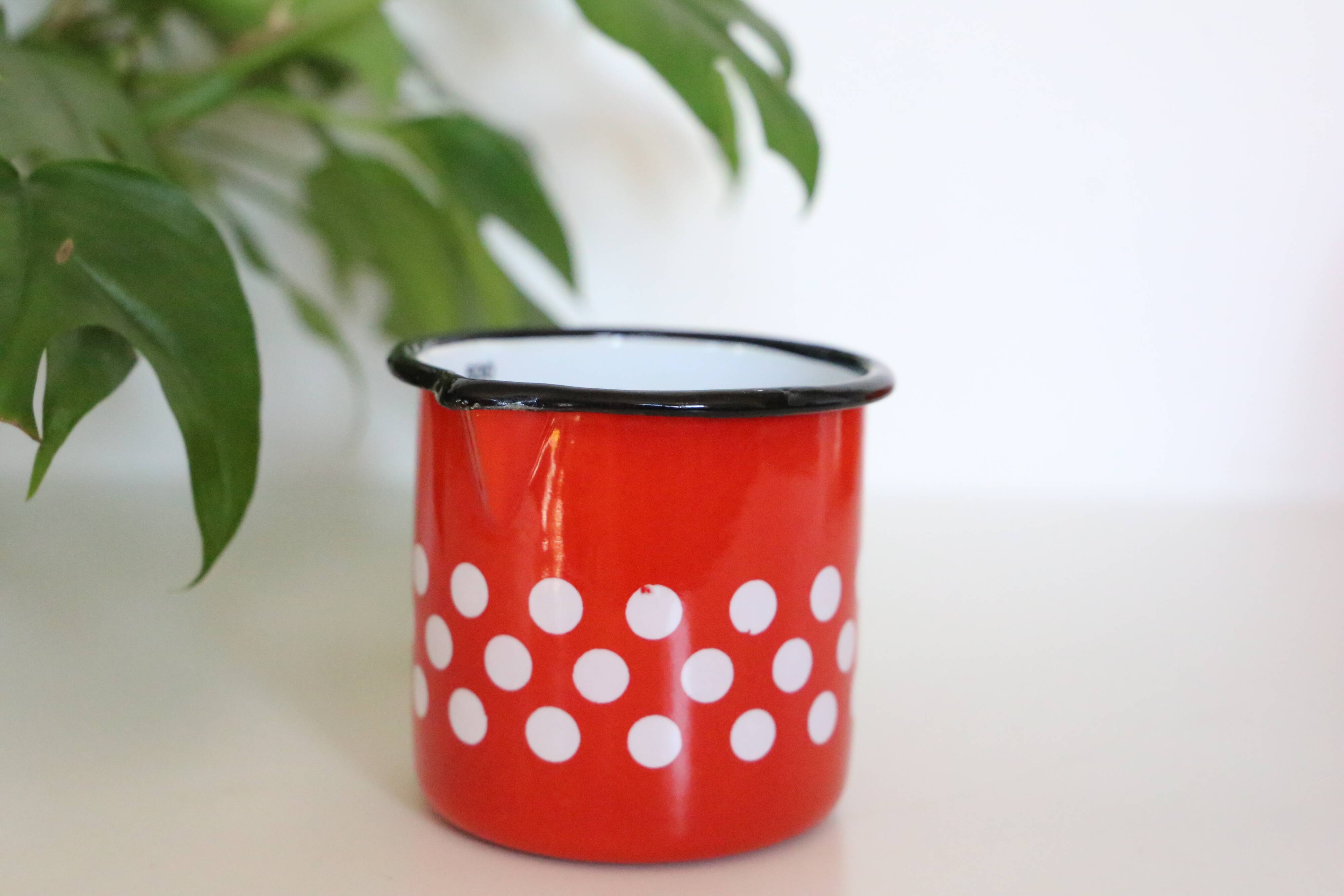 Red enamelled metal milk pot