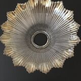 Transparent, slightly amber glass tulip. Vertical streaks.