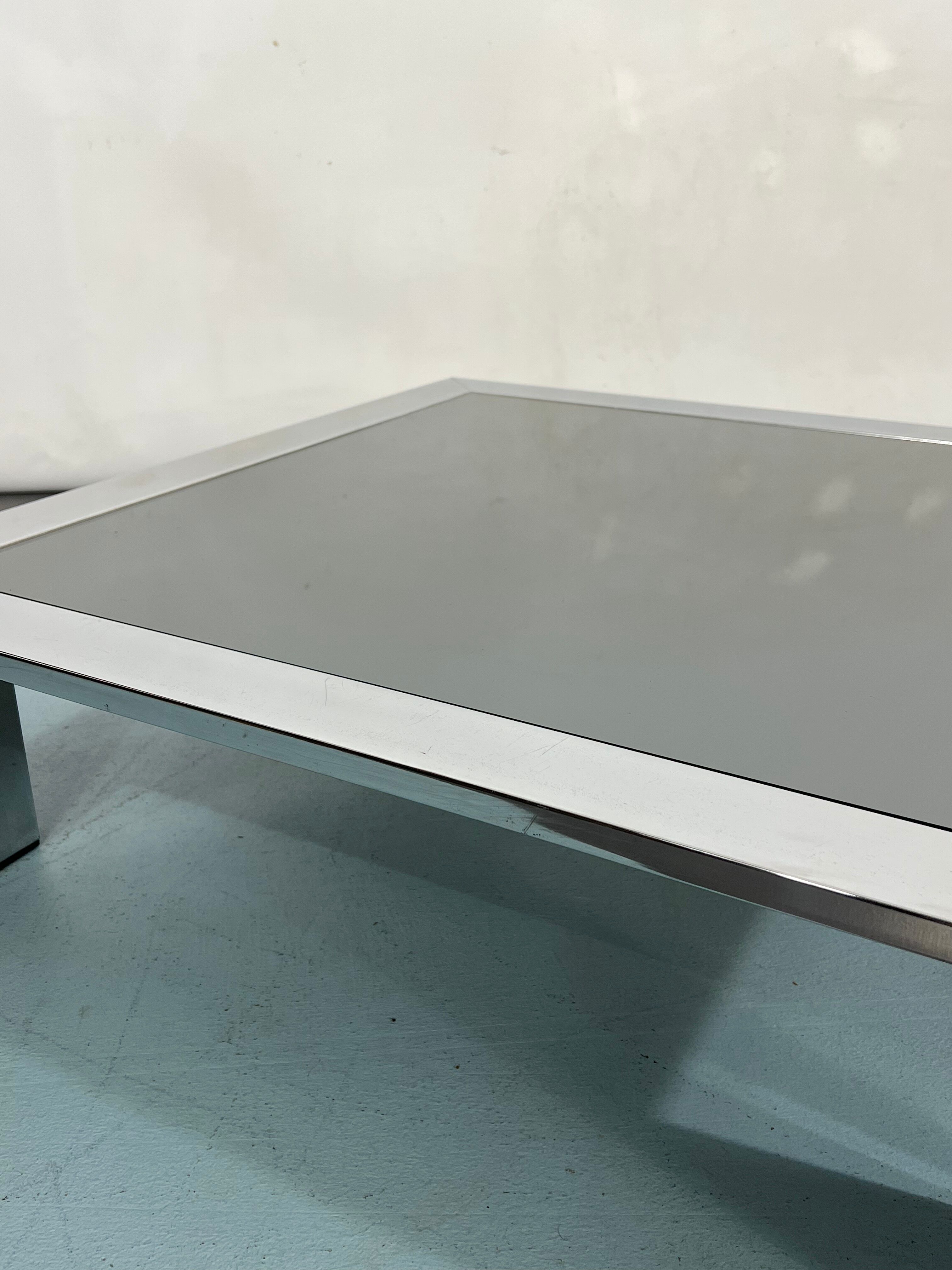 Mid-century chrome and dark mirror glass side table attributed to Saporiti. Italy 1970s