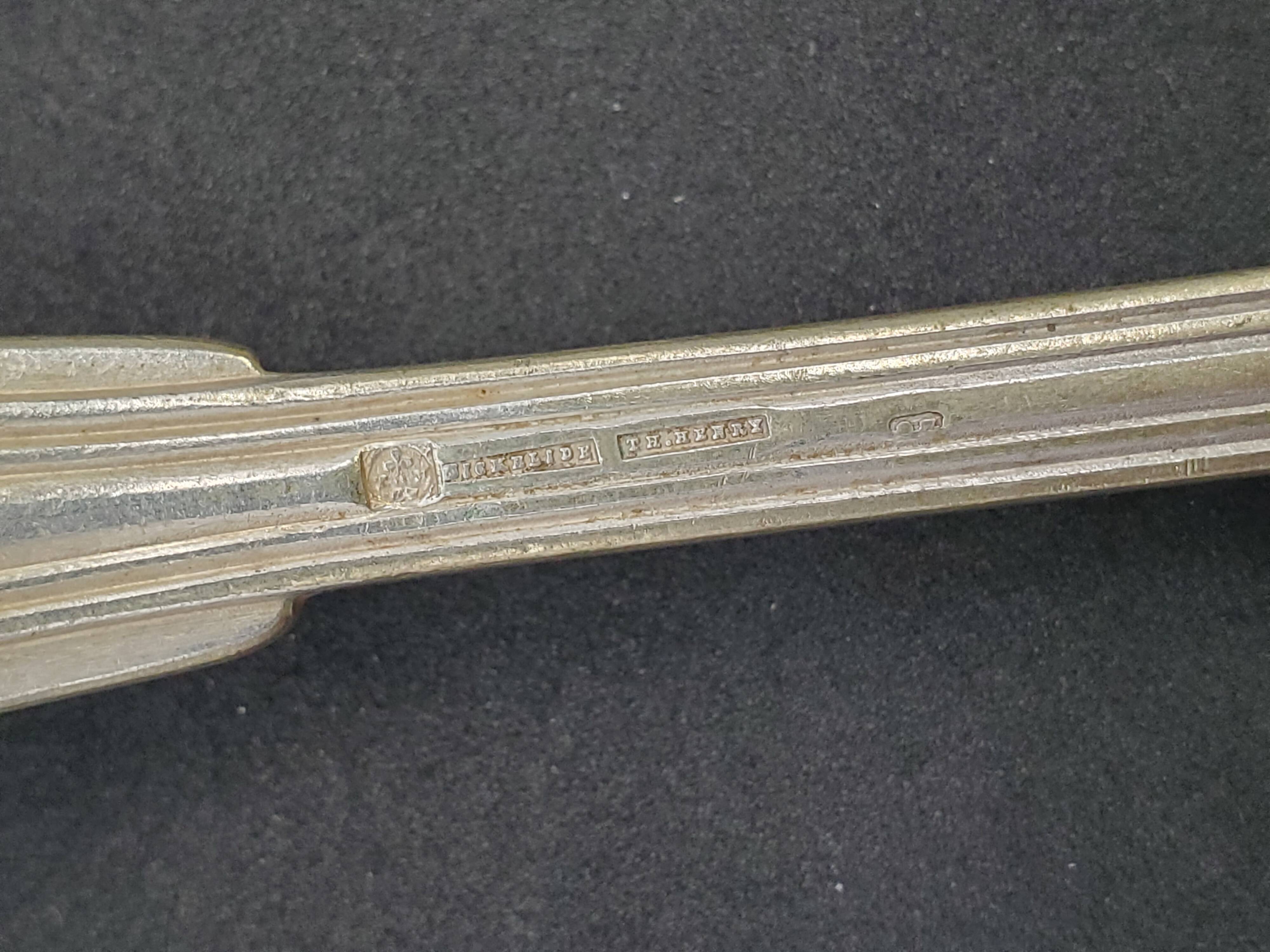 Set of 7 silver-plated dessert spoons with a bi-lobed filet pattern.