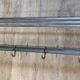 Large chrome metal wall coat rack with Art Deco shelf