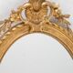 Pair of 19th century French oval gold leaf mirrors