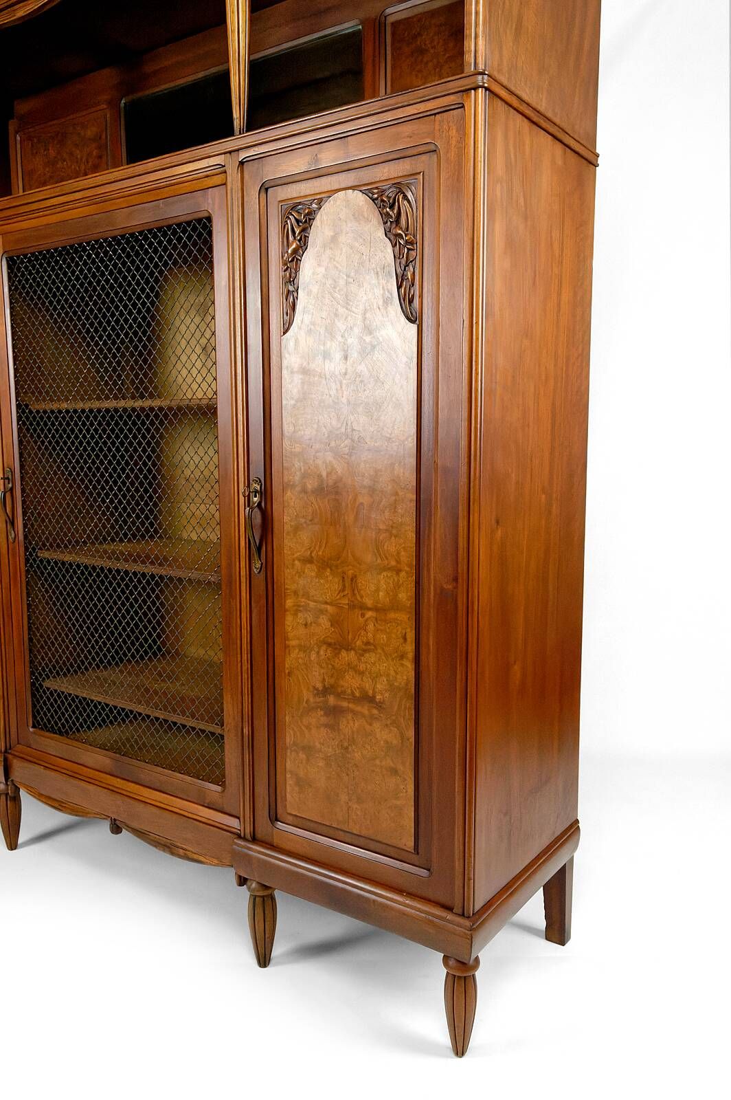 Art Deco showcase bookcase in carved walnut, France, circa 1925