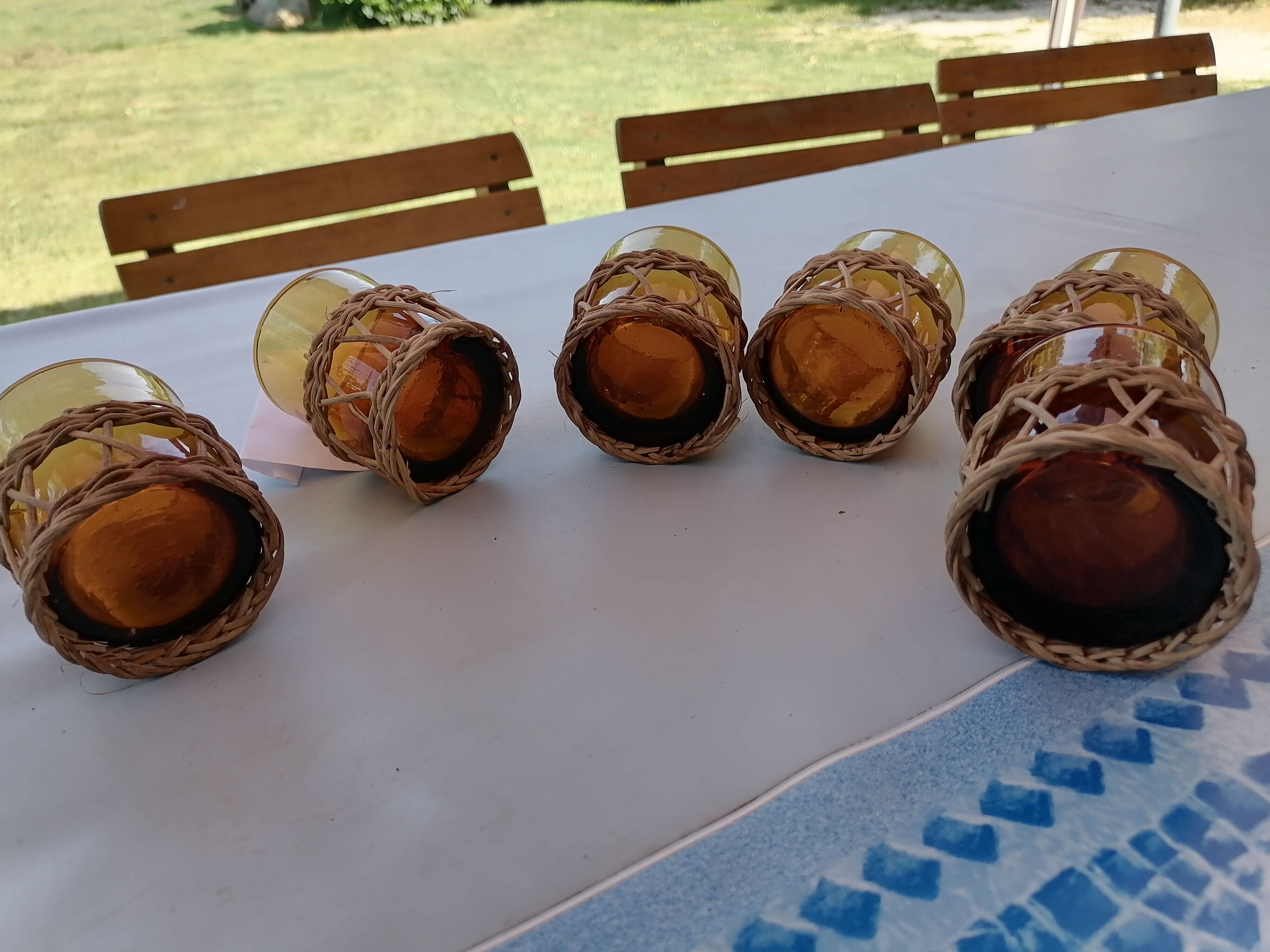 6 small glasses Amber Blown Glass garnished wicker 1 cracked