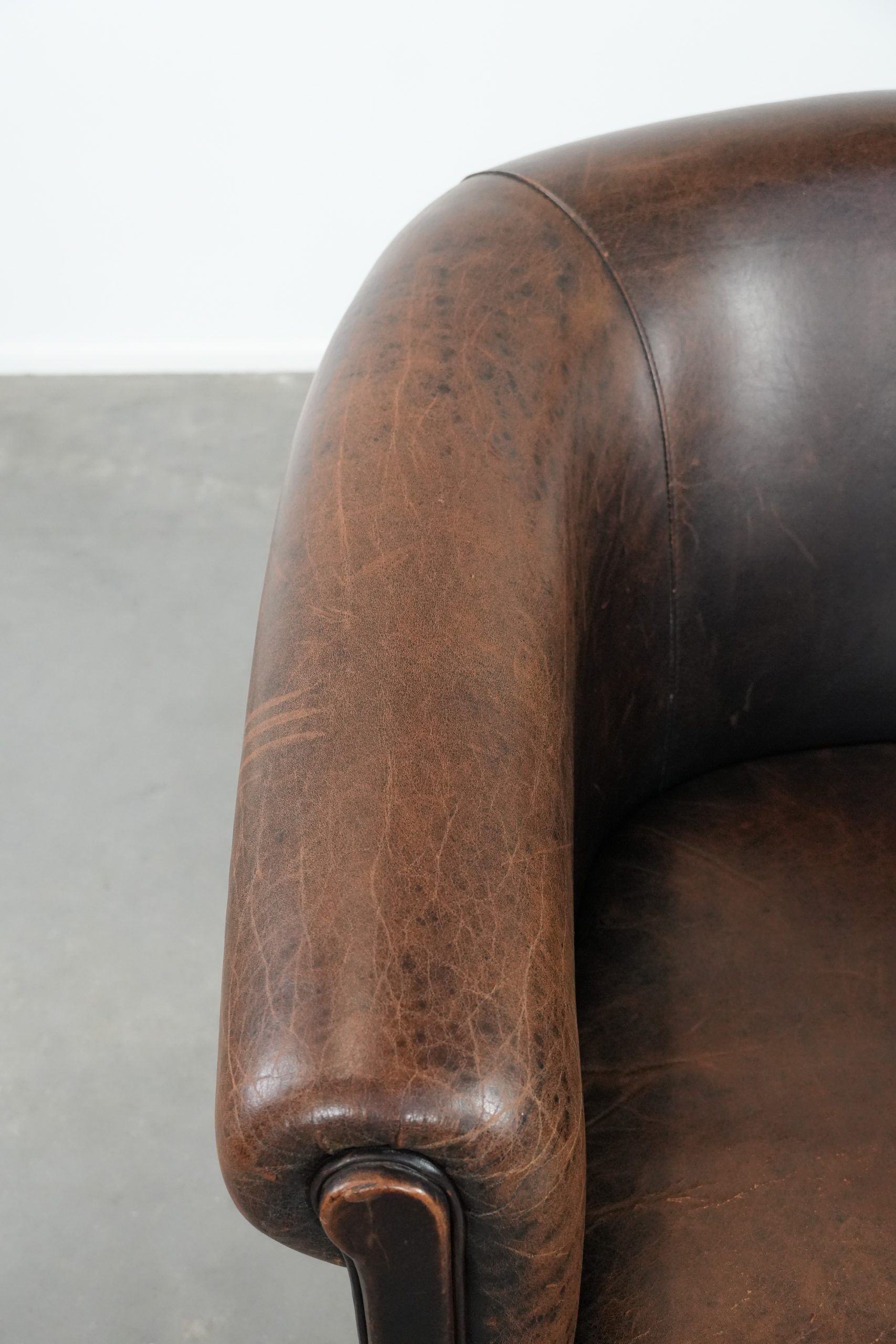 Characterful club armchair made of sheepskin with a beautiful patina