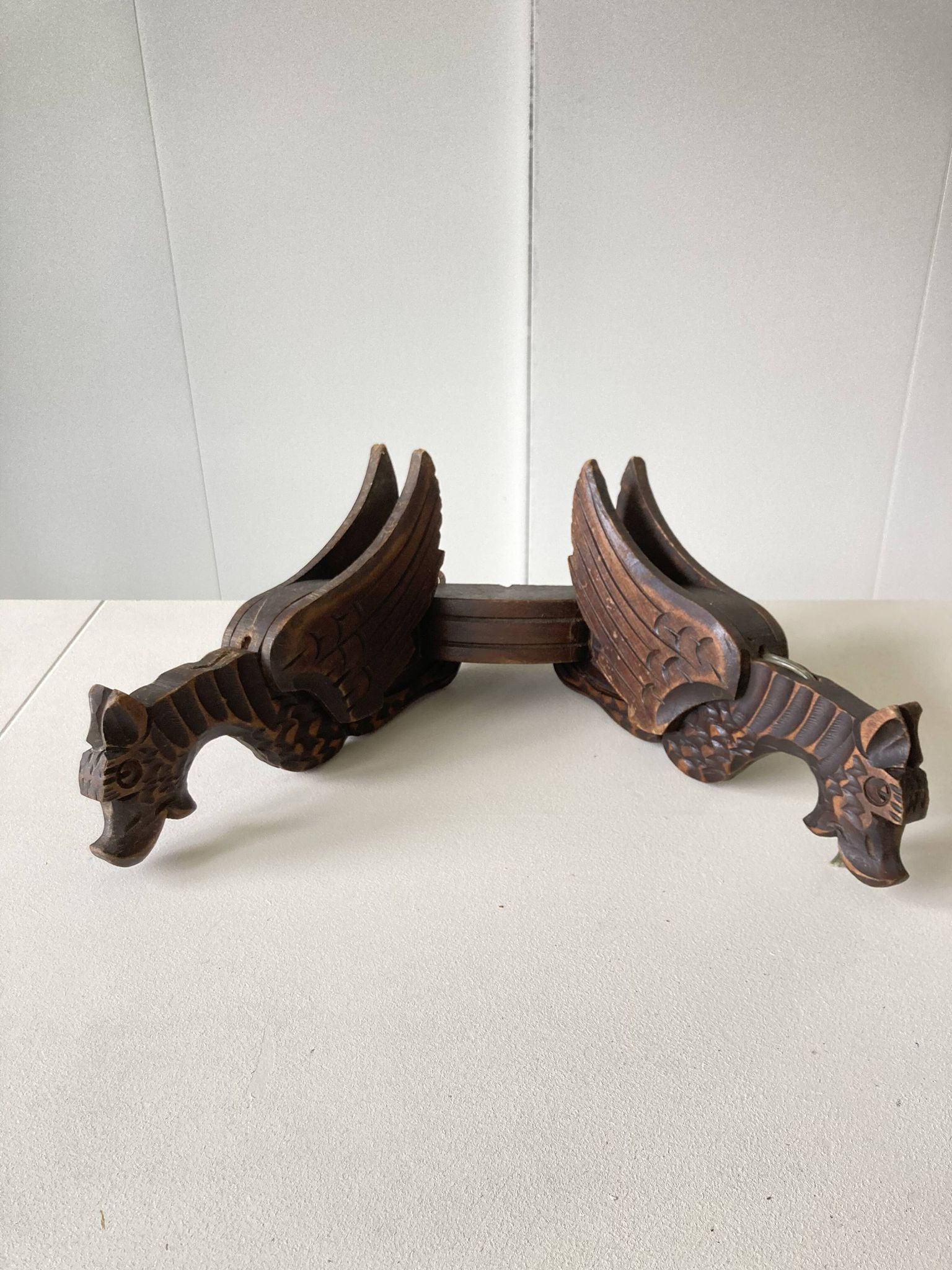 Pair of winged dragon sconces in carved wood