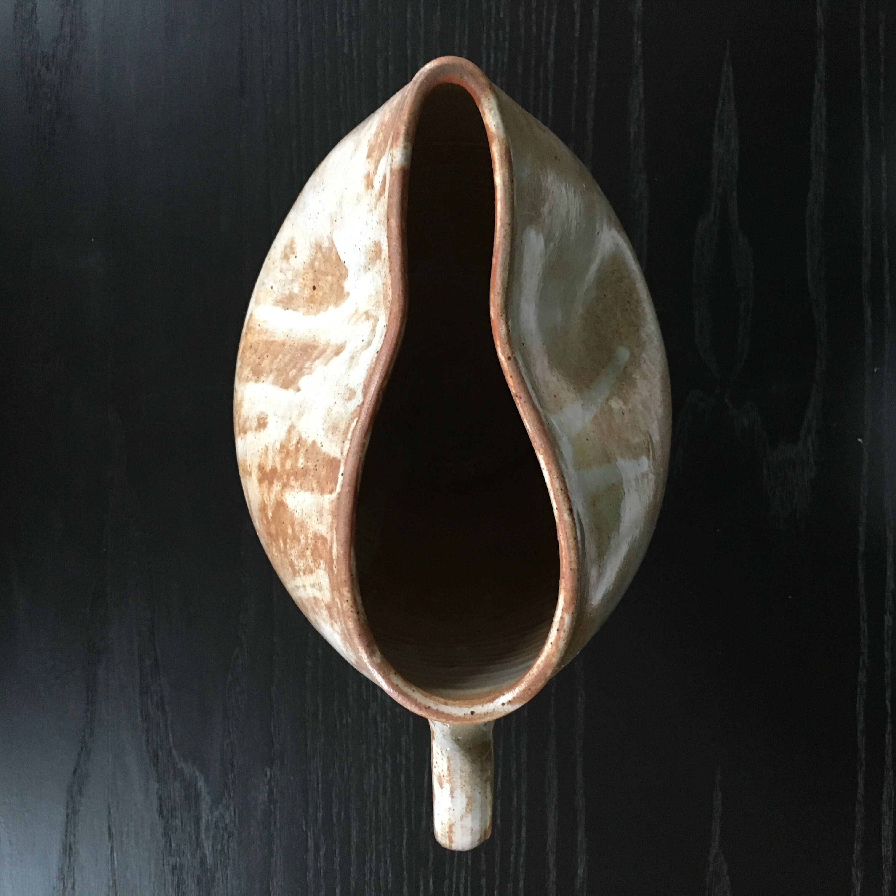 Beige stoneware pitcher with white drips