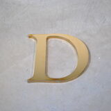 Letter sign in gold metal "D" 1980
