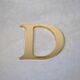 Lettre enseigne en métal dorée "D"  1980