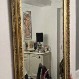 Large antique mirror from the Napoléon III era, finely carved and gilded with gold leaf.